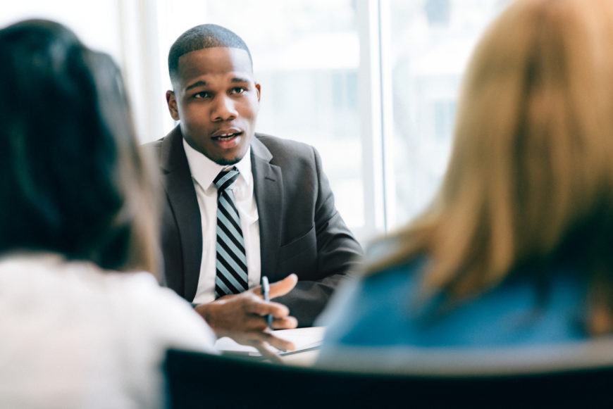 Two women at a meeting with a franchise adviser